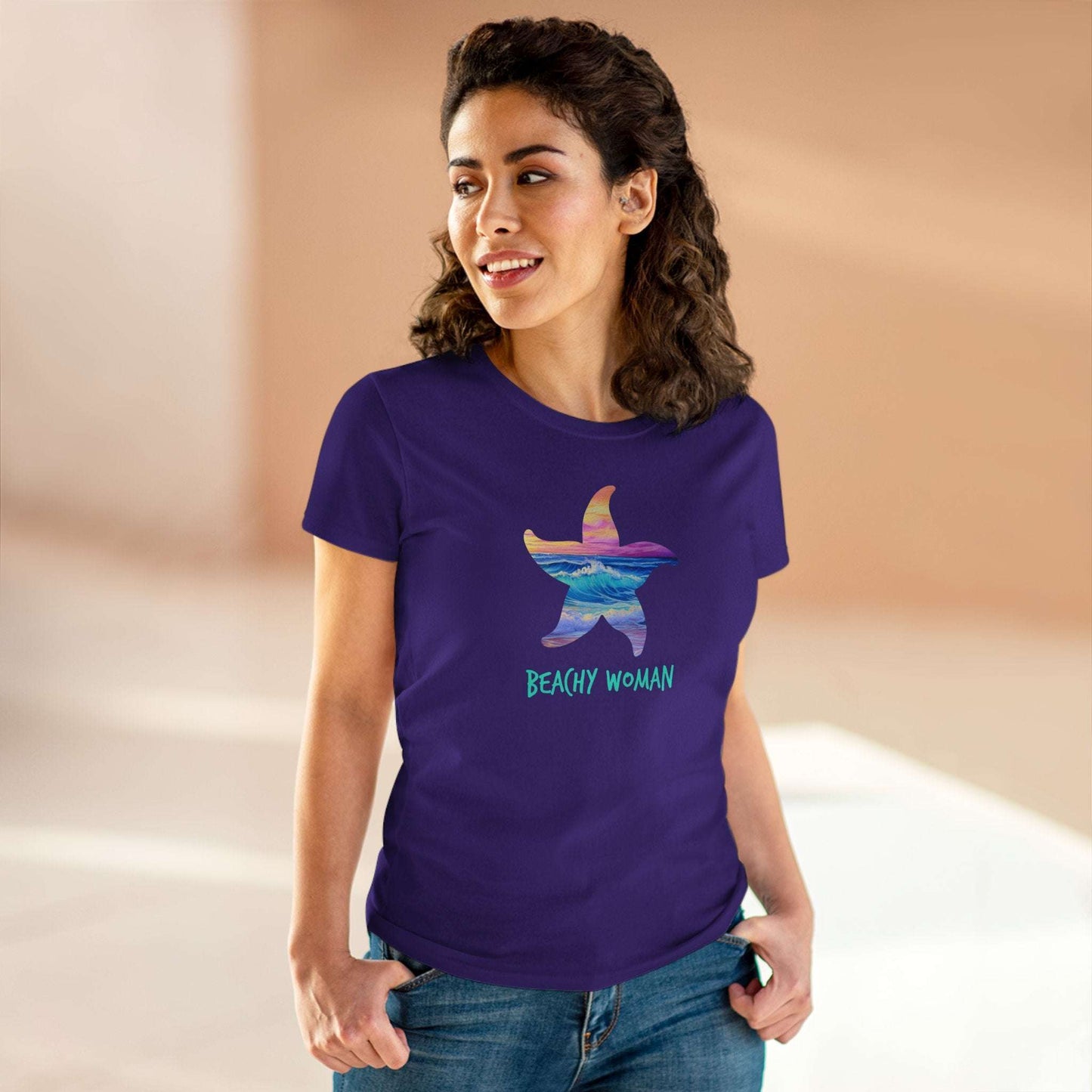 Woman wearing a vibrant purple Starfish Beach t-shirt, perfect for casual summer outings and beach vacations.