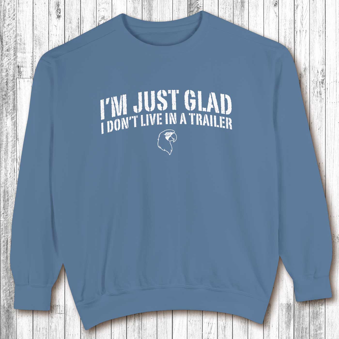 Blue sweatshirt with white text on a wooden background