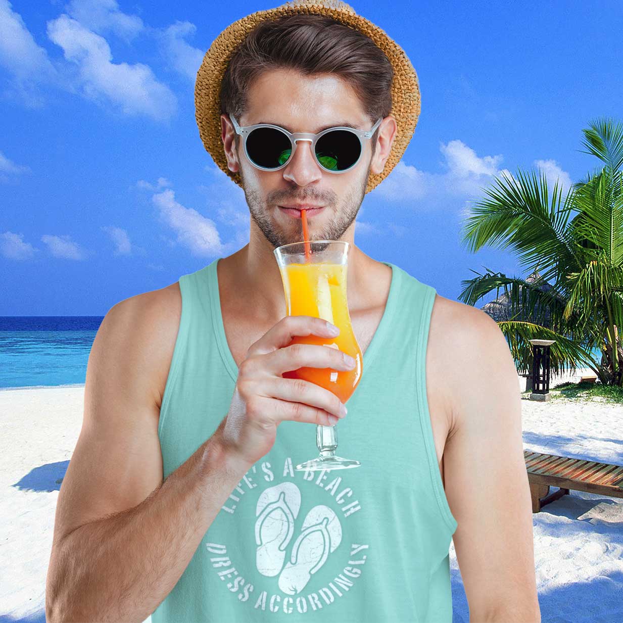 Man drinking a colorful beverage on a beach with palm trees and blue sky.