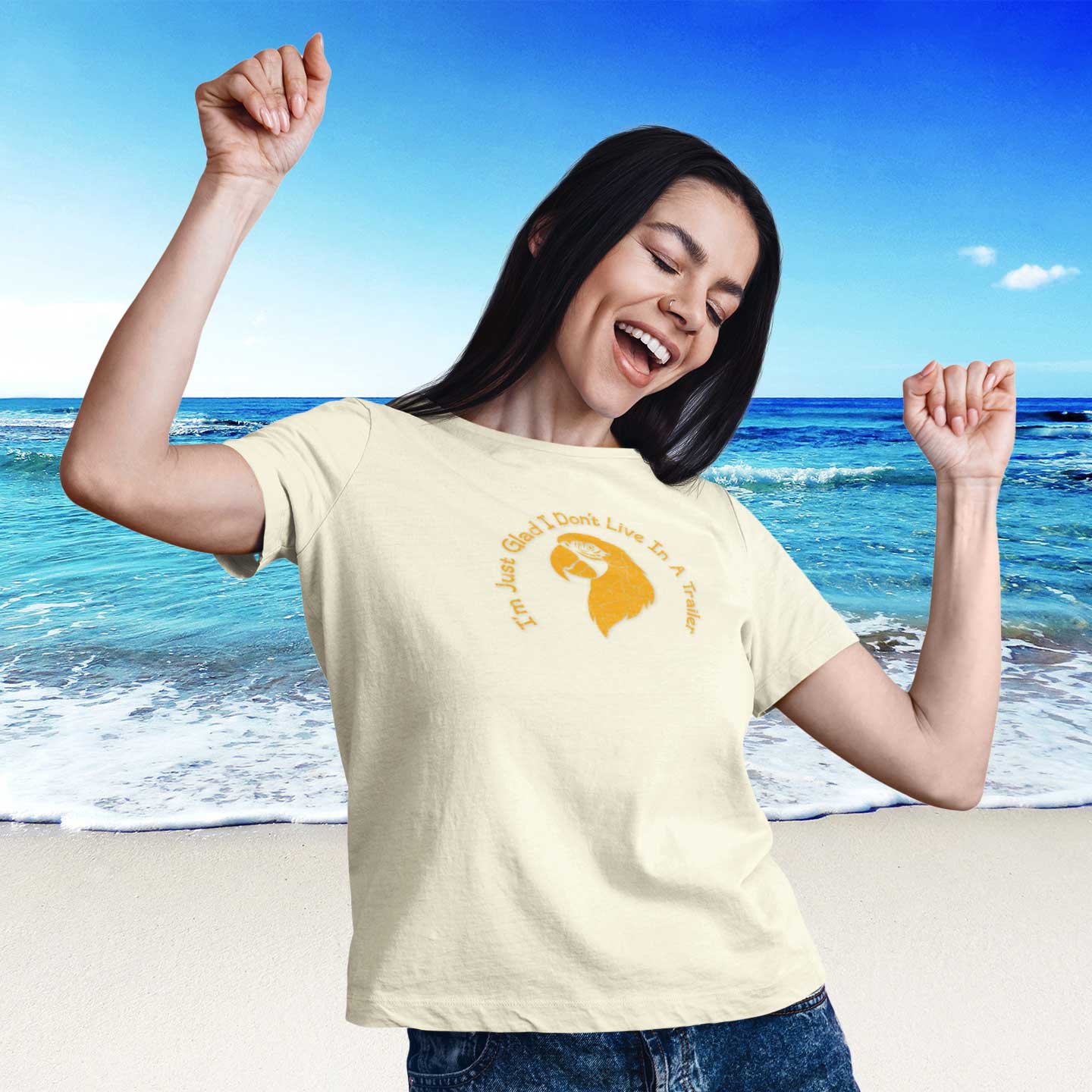 Woman wearing a yellow t-shirt with a graphic design on a beach