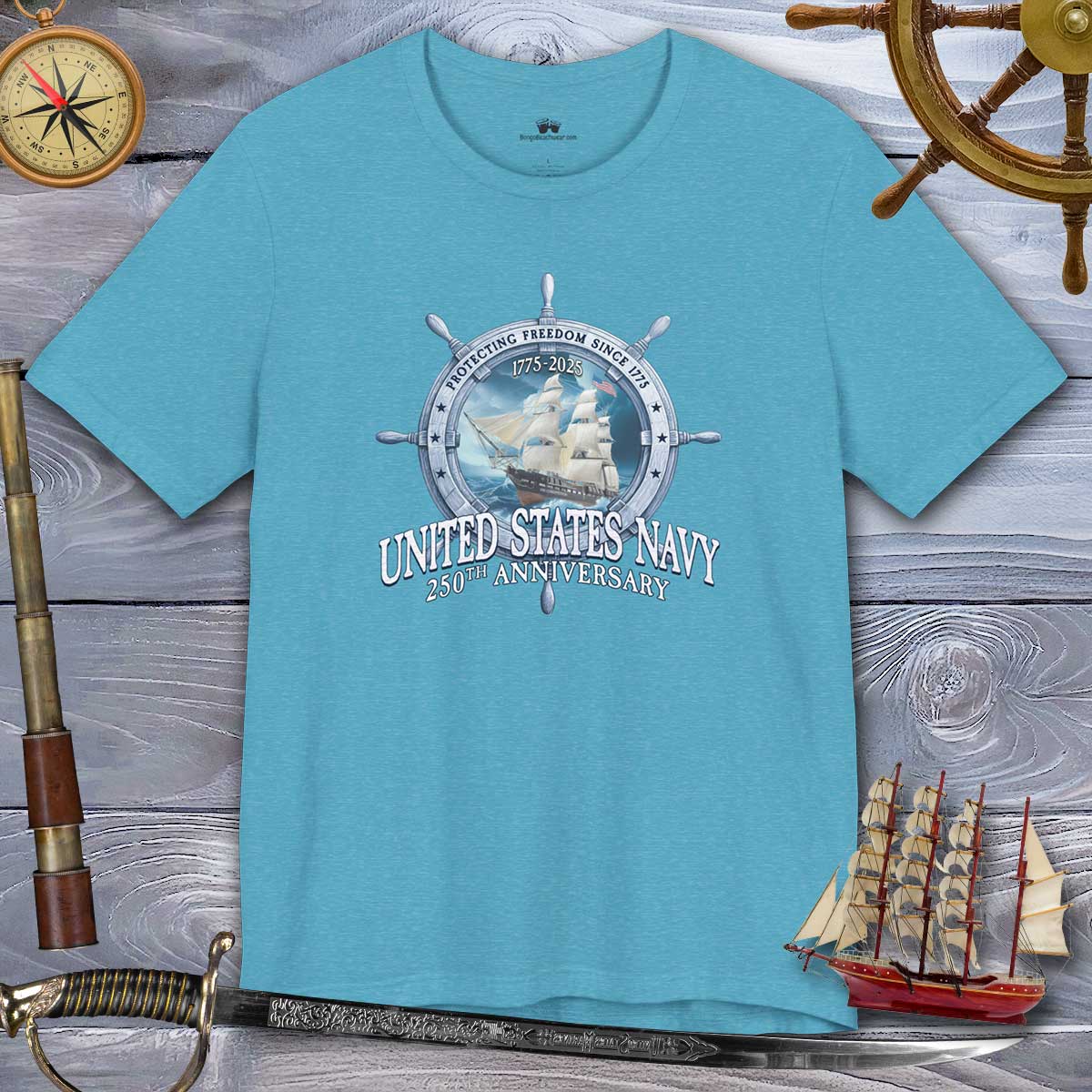 Blue t-shirt with United States Navy 250th Anniversary design on a wooden background with nautical items.