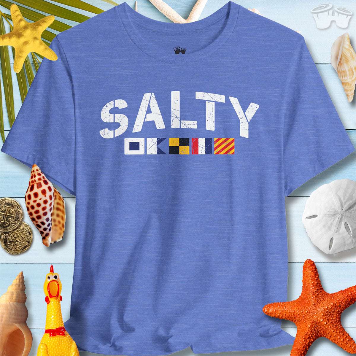 SALTY nautical signal flags t-shirt on a coastal background with seashells and starfish, perfect for ocean lovers.