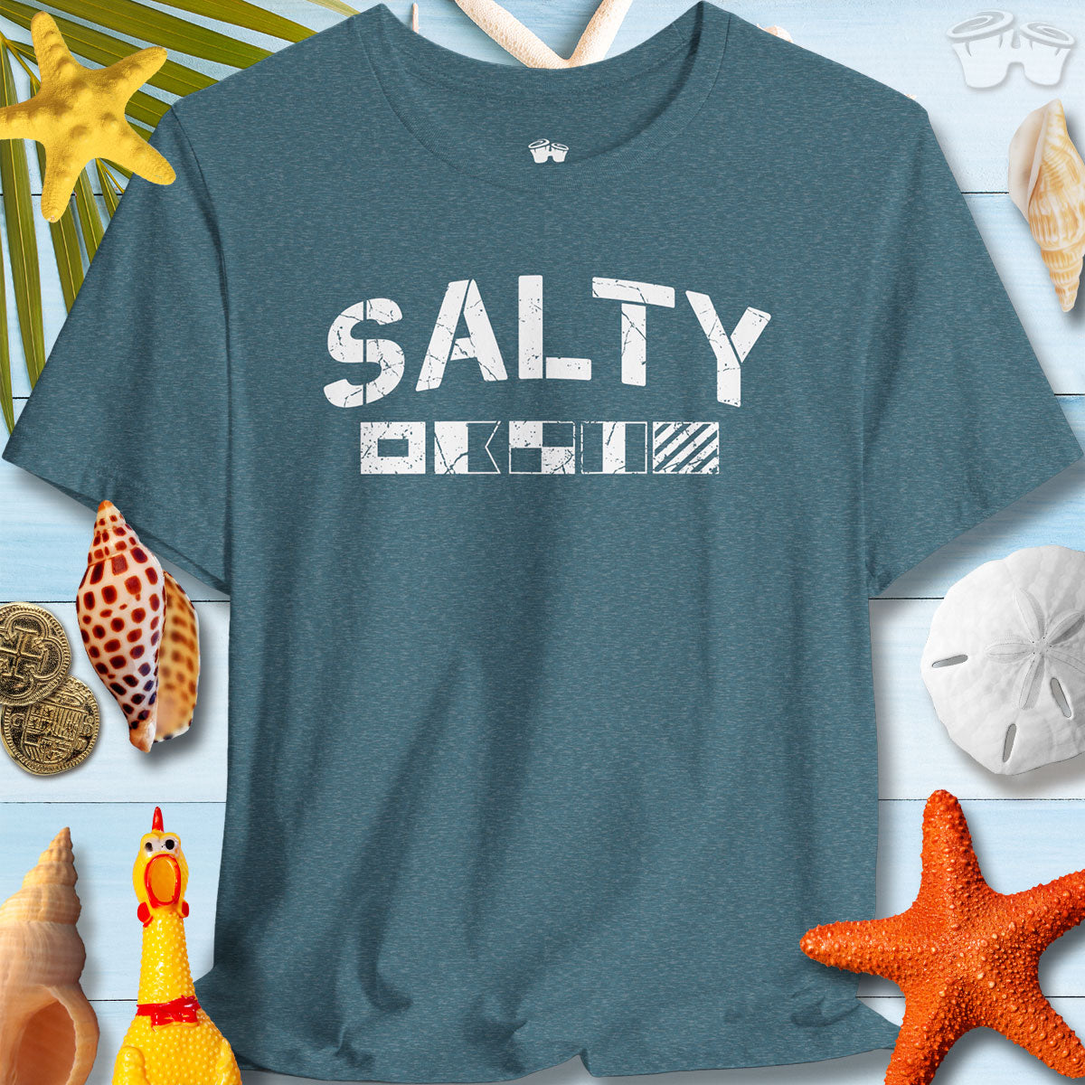 Salty Coastal Vibes Bella Canvas T-Shirt with nautical flags on a beach-themed background.