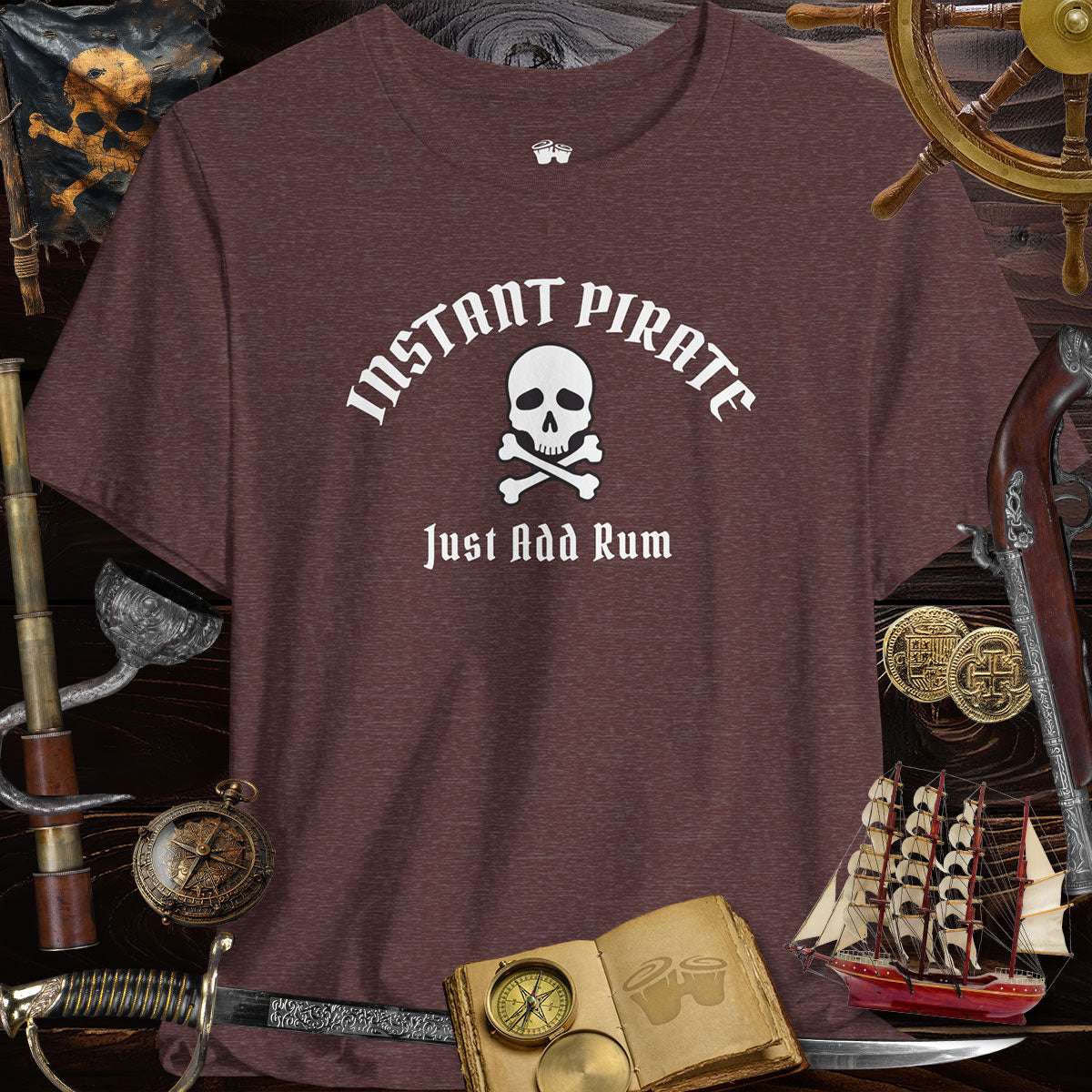 Instant Pirate Just Add Rum Unisex Bella Canvas Tee Shirt on a background of pirate-themed items.