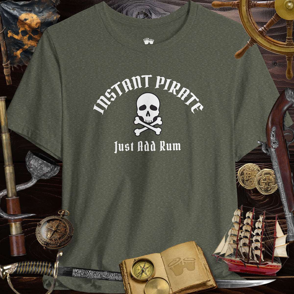 Instant Pirate Just Add Rum Unisex Bella Canvas Tee Shirt on a wooden surface with pirate accessories.