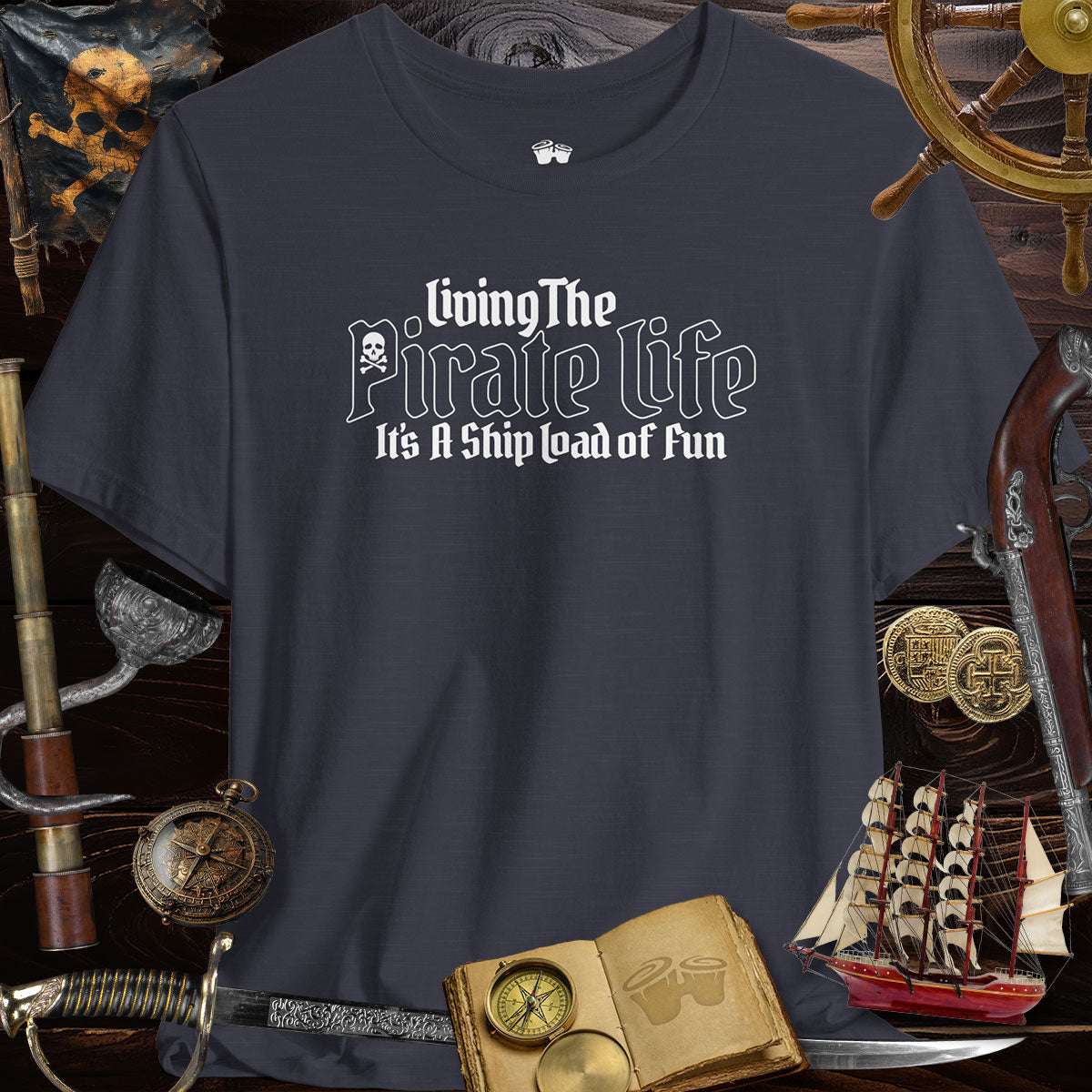 Pirate's Life Unisex Tee featuring 'Living The Pirate Life - It's A Shipload of Fun' against pirate theme background.