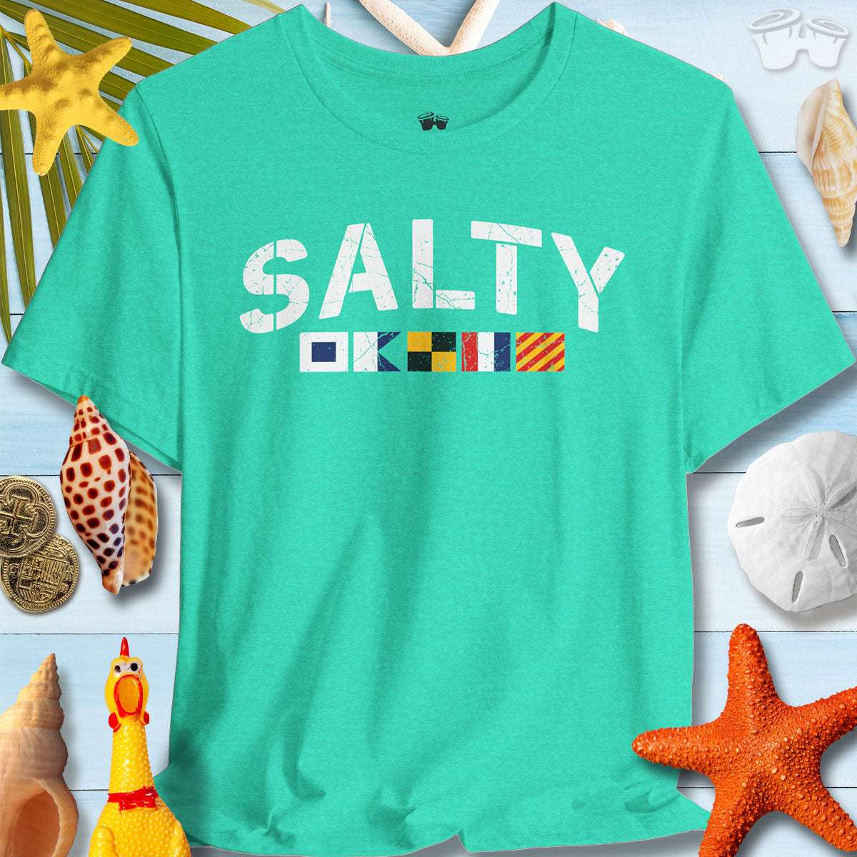 Salty T-shirt featuring nautical signal flags on a teal background with seashells and starfish.
