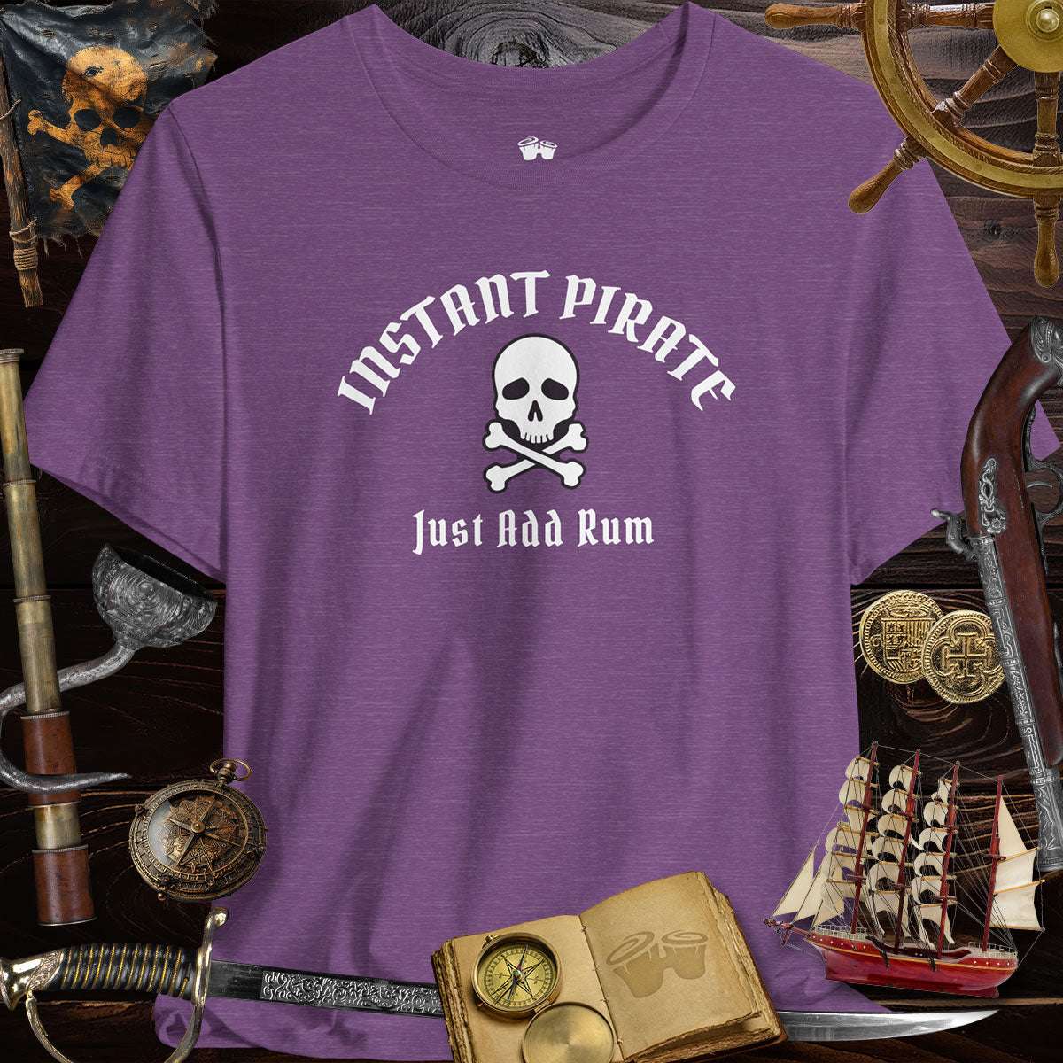 Instant Pirate Just Add Rum Unisex Bella Canvas Tee Shirt in purple surrounded by pirate-themed decor.