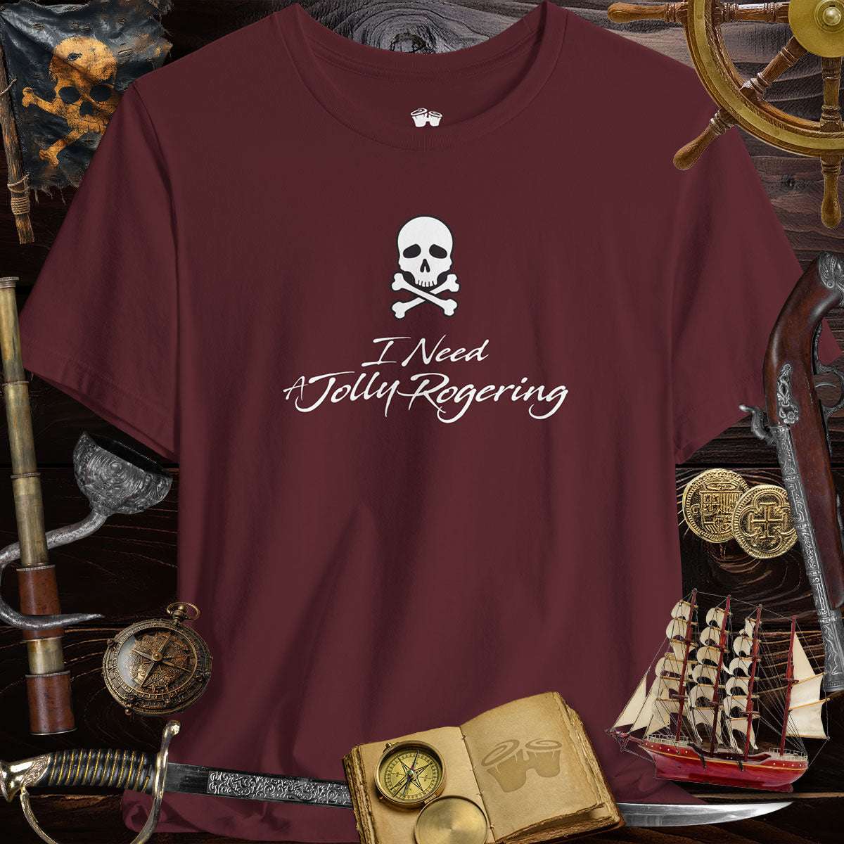 Funny pirate T-shirt with skull and crossbones, saying 'I Need A Jolly Rogering' in stylish print.