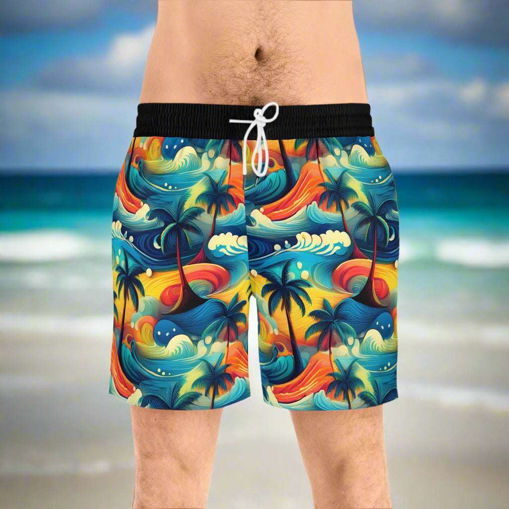 Guy standing on the beach wearing cool board shorts by bongo beachwear