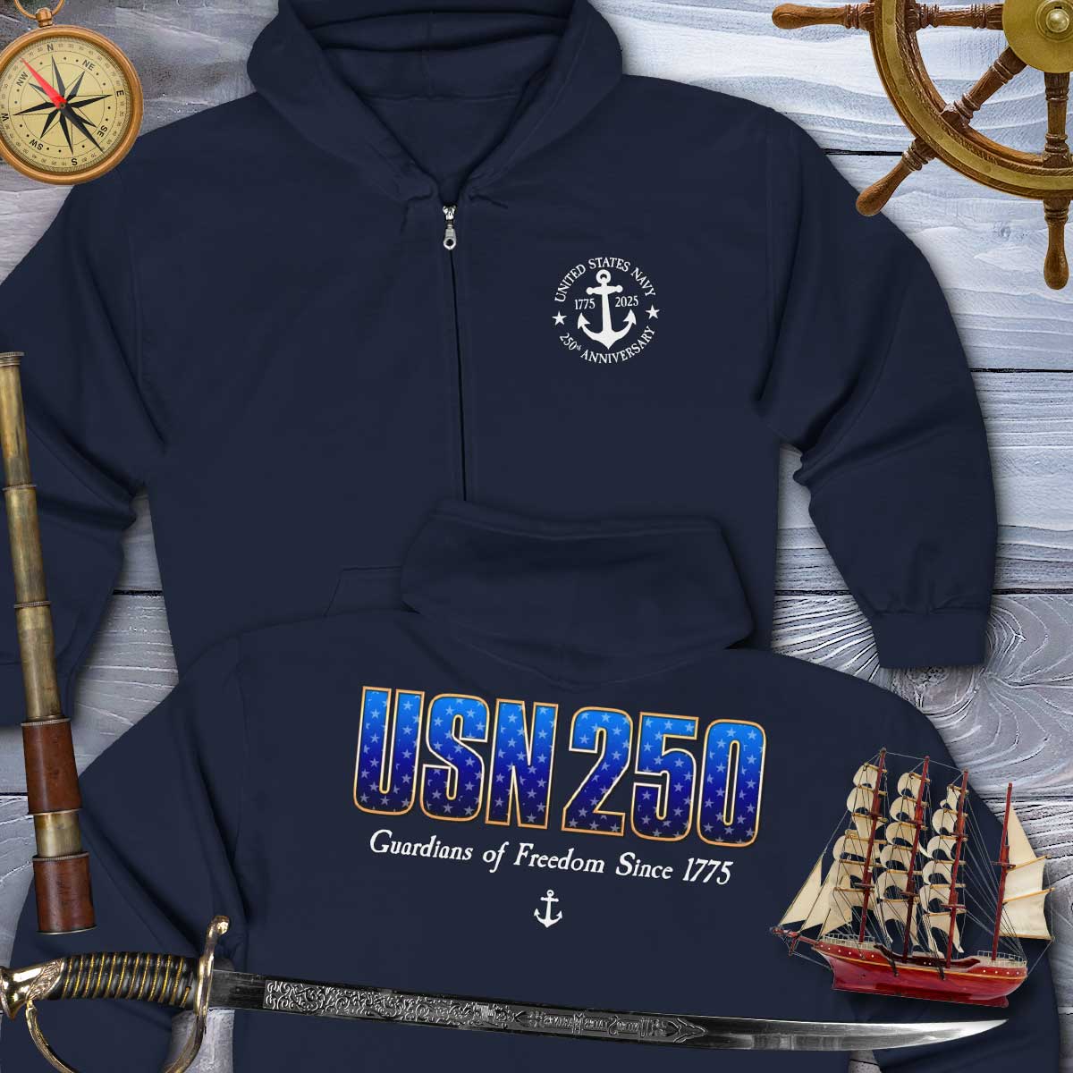 Navy blue hoodie with USN 250 design on a wooden background with nautical items.