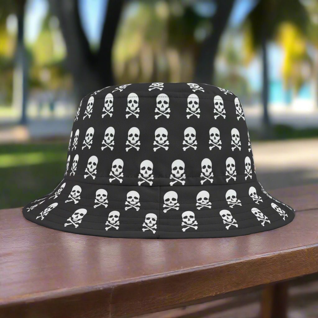 Cool black bucket hat with pirate pattern sitting on a park bench in Key West