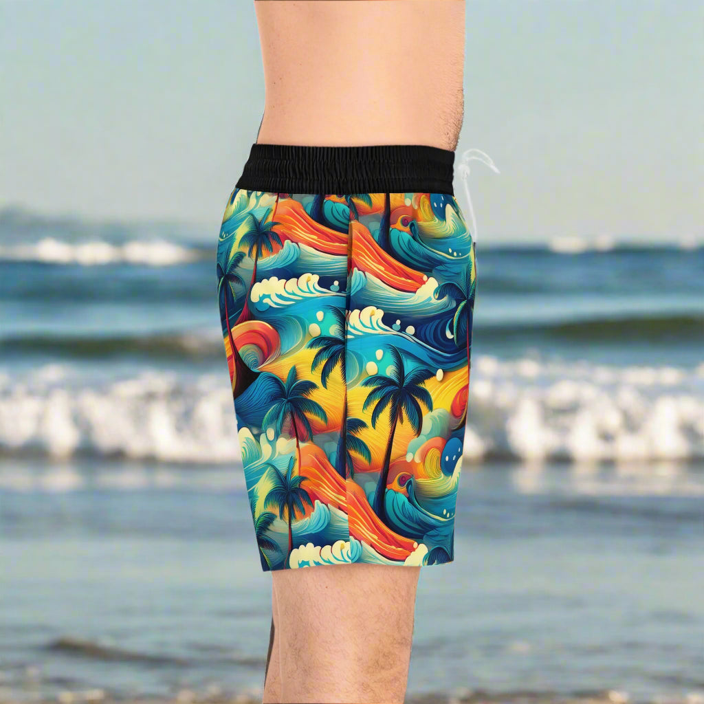 Surfer standing on the beach waiting for high tide in a pair of Bongo Beachwear Board shorts