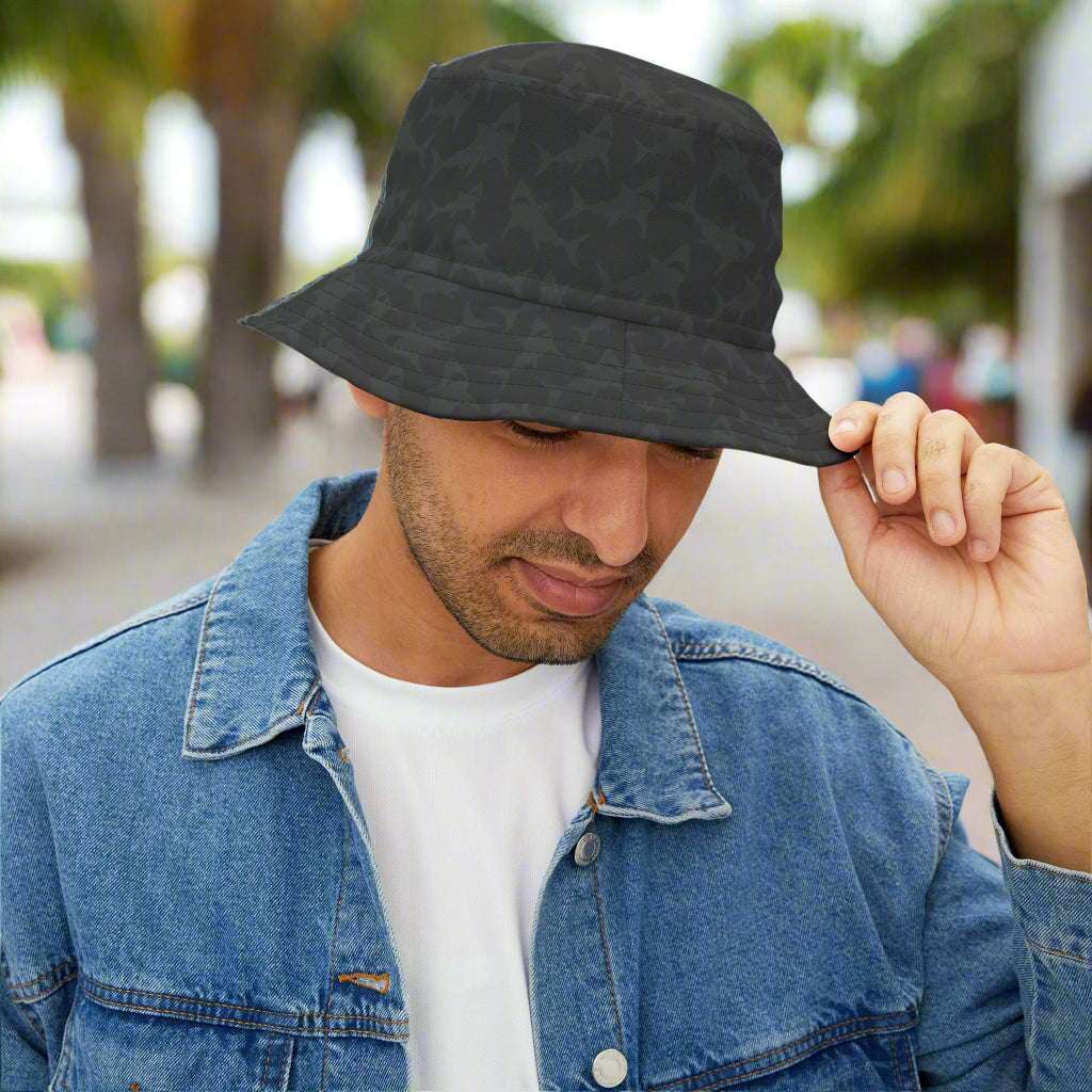 Black Bucket hat with subtle shark pattern worn by dude hanging out in Key West