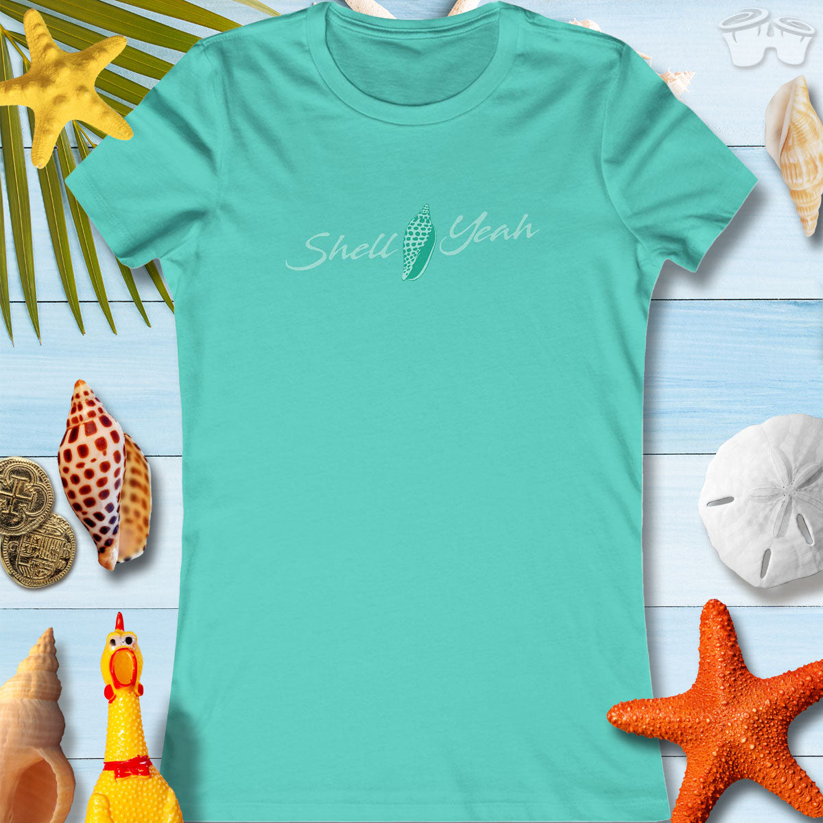 Women's seafoam tee featuring 'Shell Yeah' text, perfect for beach lovers and casual summer outings.