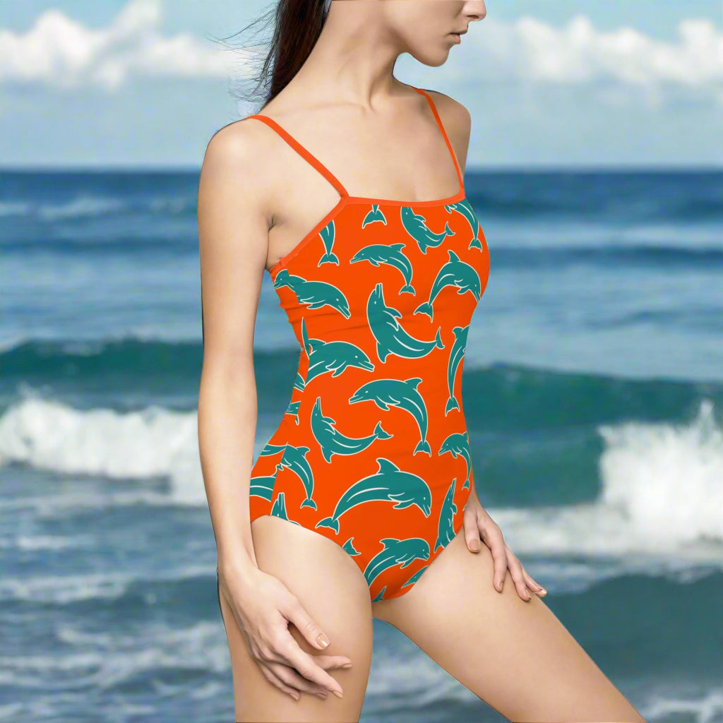 Swimwear Model in Miami Dolphin team colors standing by the sea