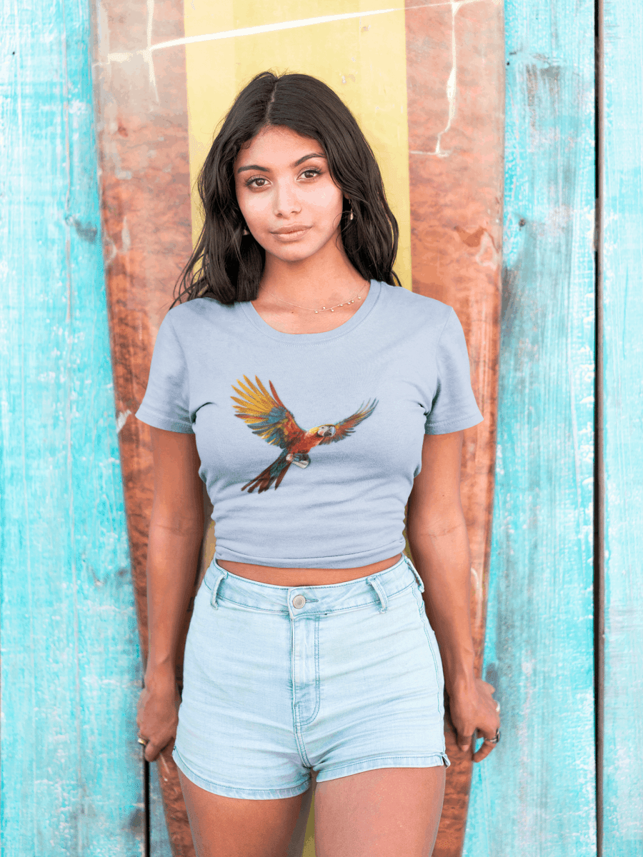 Surfer girl wearing a parrot head tee featuring beautiful parrot flying away with Jimmy Buffett's Lost shaker of Salt