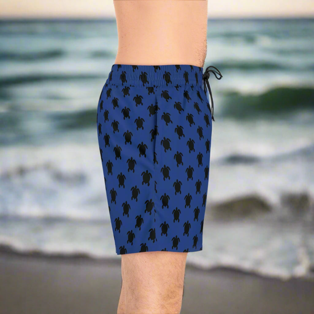 Dark Blue Bathing trunks on a guy standing on the beach