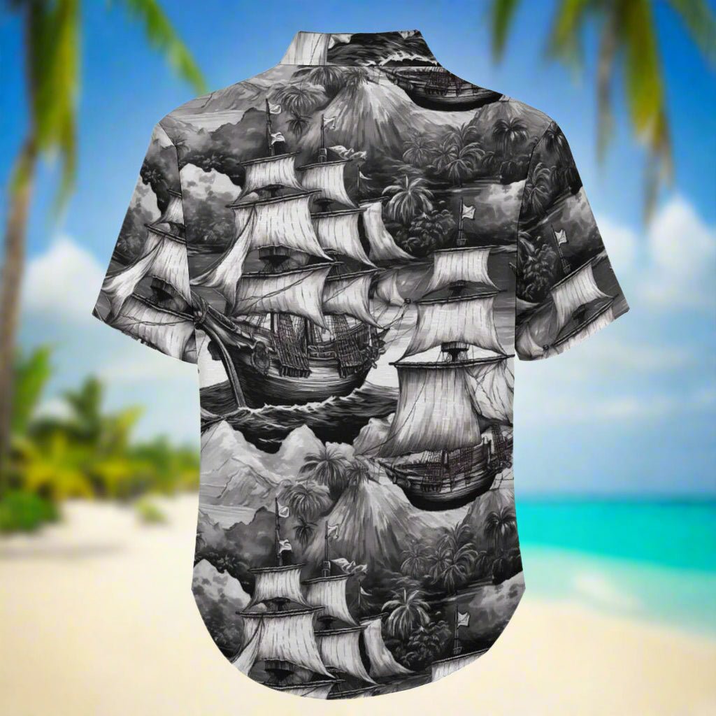 Hawaiian shirt with black and white pirate ship design on a Caribbean beach background