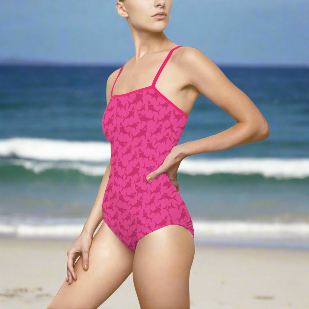 Woman in Hot Pink Shark Bathing Suit Standing on the beach