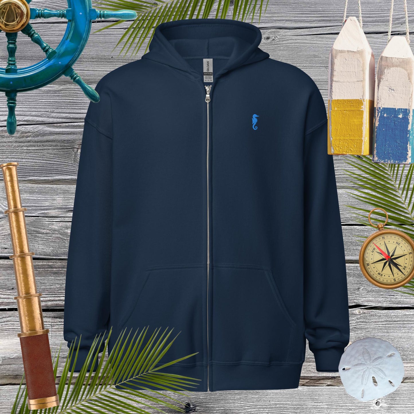 Unisex heavy blend zip hoodie with seahorse embroidery, perfect for cozy vibes and stylish looks. Ideal for casual outings.