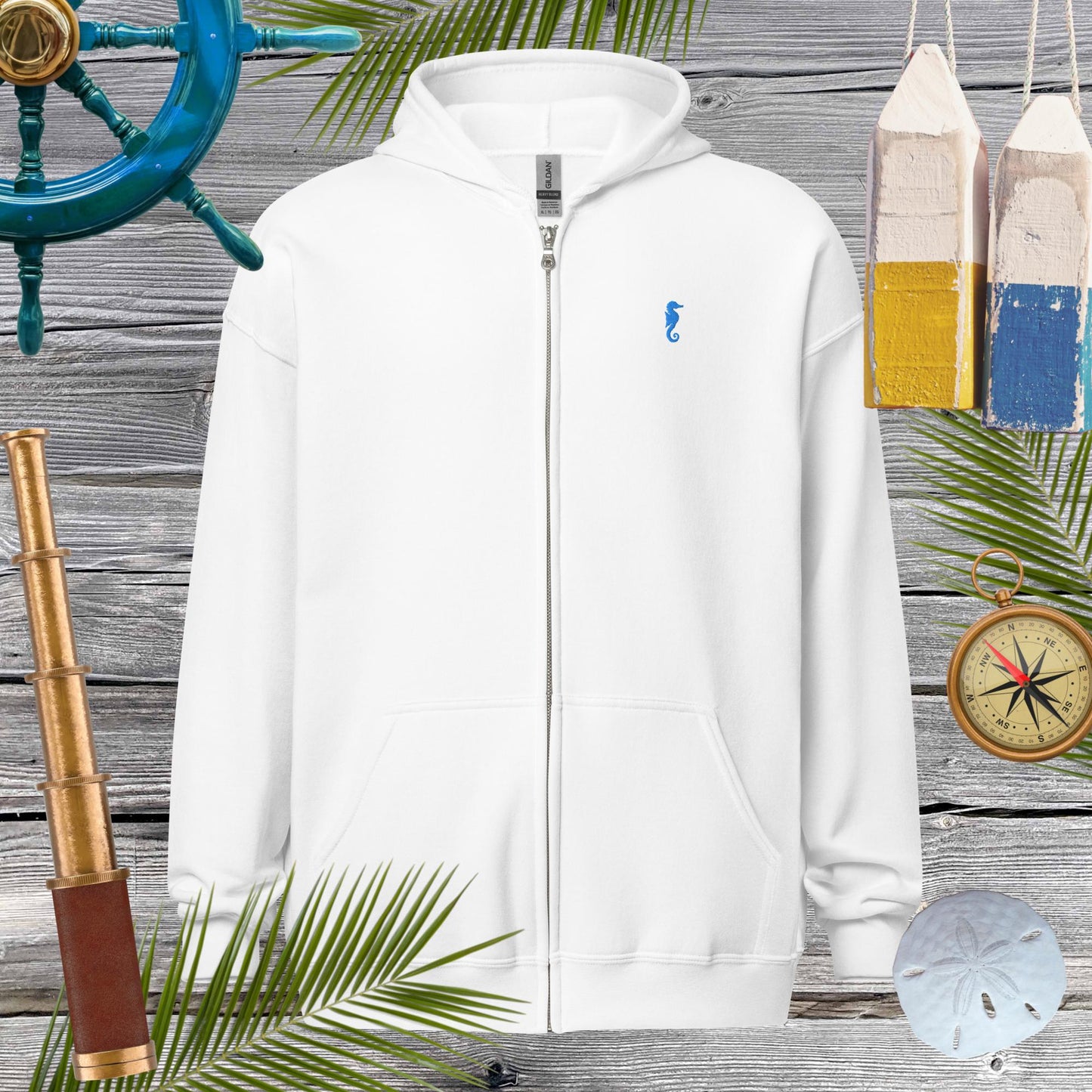 Unisex heavy blend zip hoodie featuring a cool embroidered seahorse on a white background, perfect for cozy vibes.