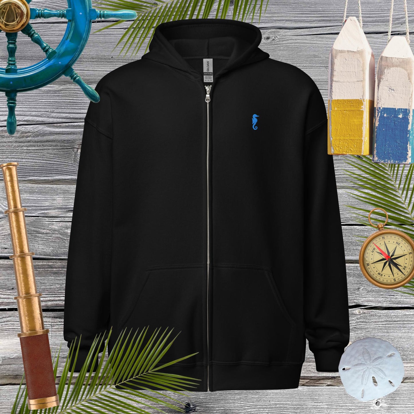 Unisex heavy blend zip hoodie with seahorse embroidery, perfect for cozy vibes and stylish looks.