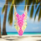 Colorful swimsuit with abstract design hanging on a line in an island beach paradise
