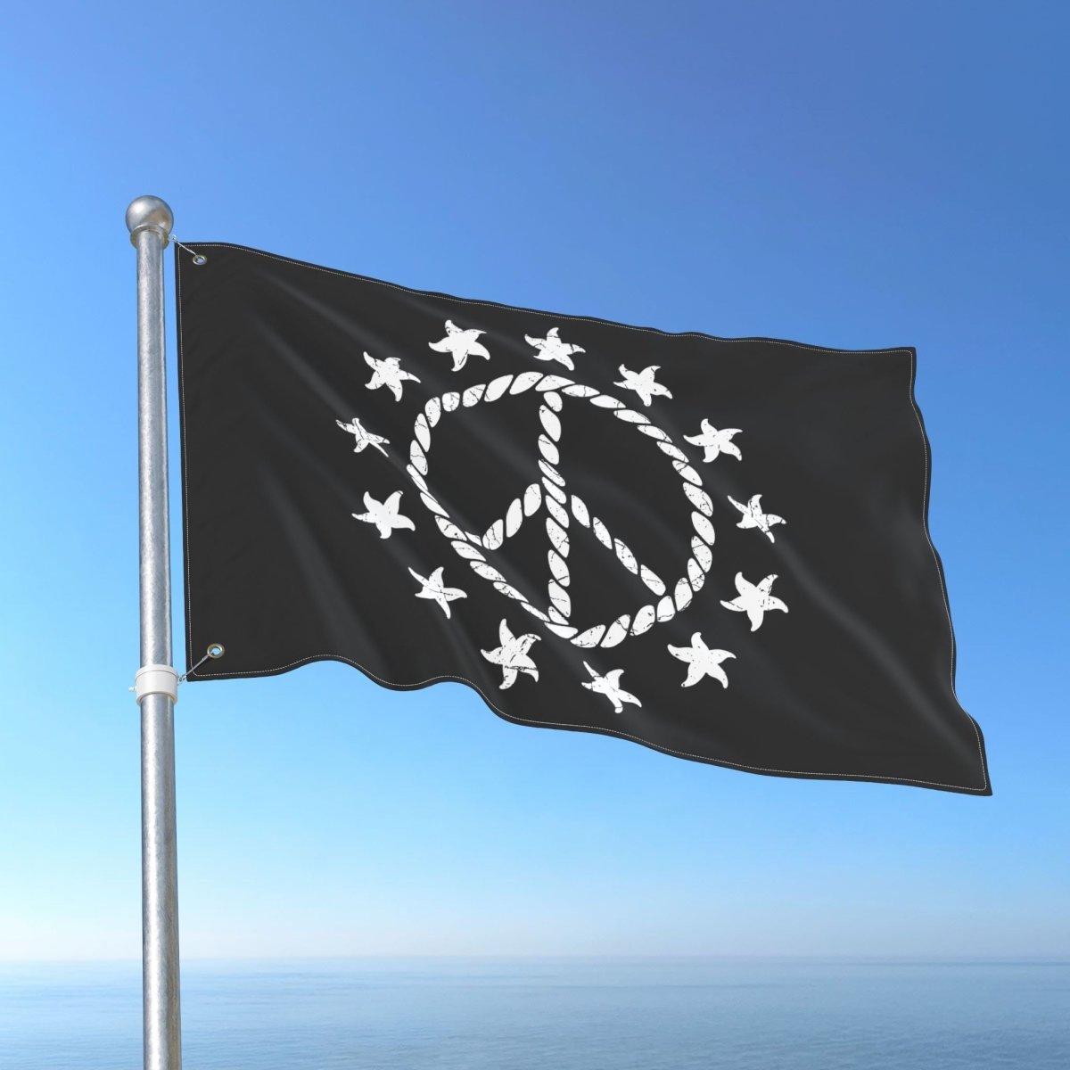 Black flag with peace symbol and stars on a blue sky background