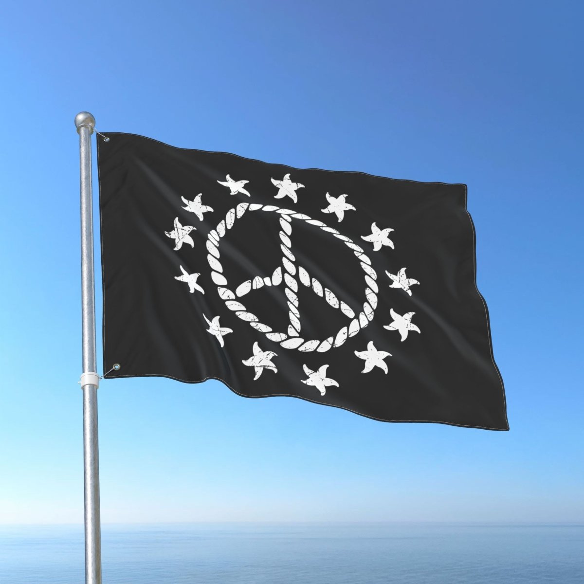 Black flag with white peace symbol and stars on a blue sky background
