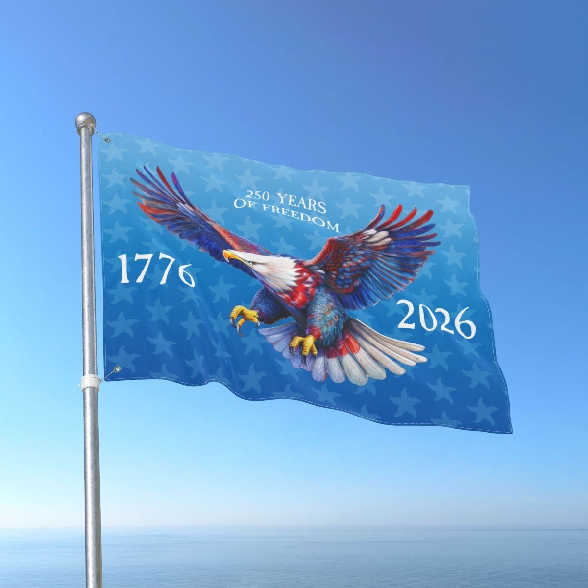 Flag with an eagle design and text '250 Years of Freedom 1776-2026' against a blue sky.