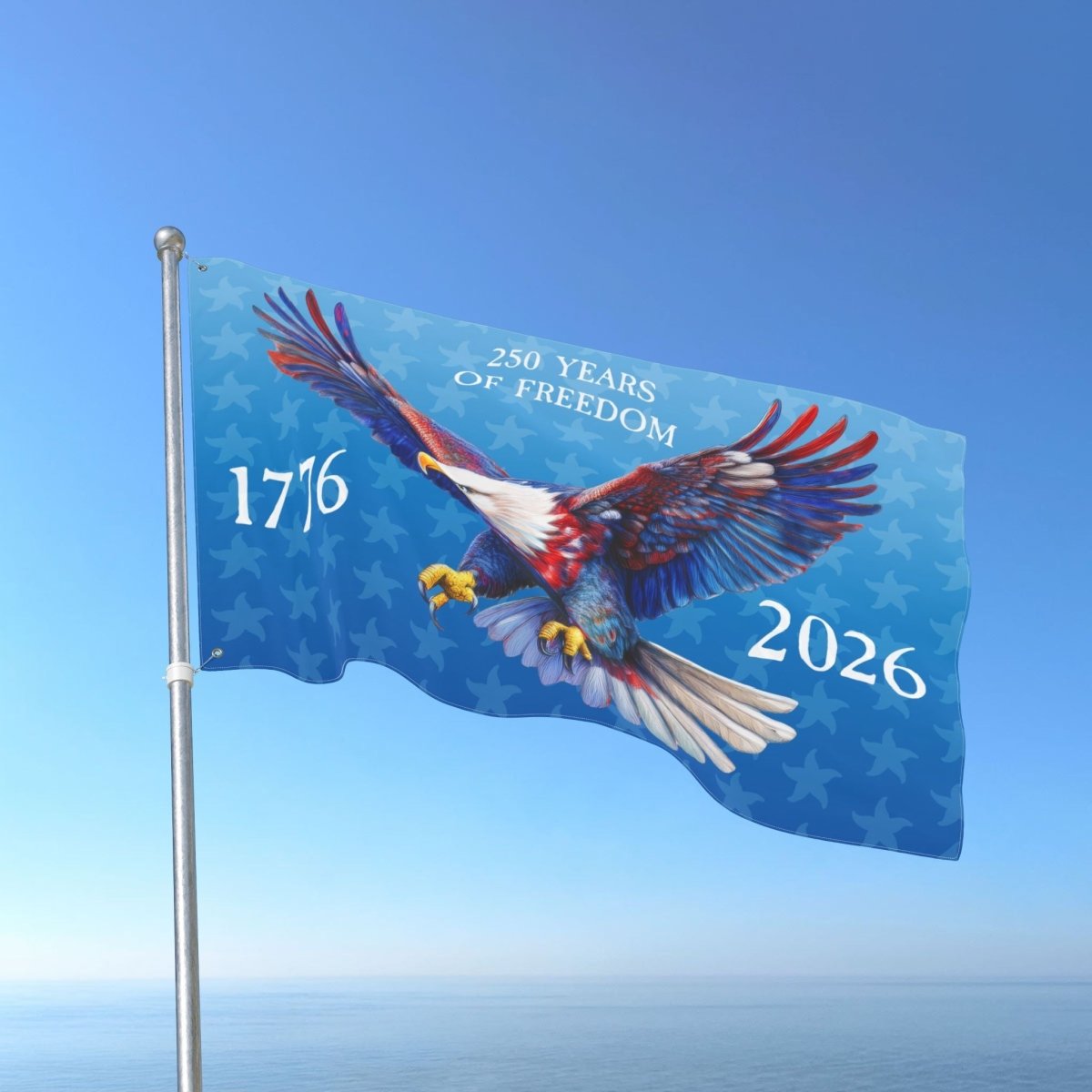 Flag with an eagle design and text '250 Years of Freedom 1776-2026' against a blue sky.