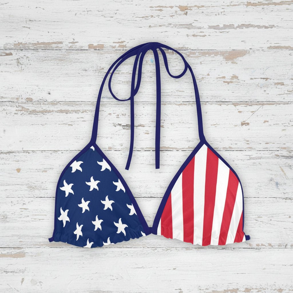 Bikini top with American flag design on a rustic wood background
