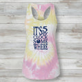 A women's racerback tank top with a pastel tie-dye pattern in pink, yellow, and white, featuring the text 'IT'S 5 O' CLOCK SOME WHERE' printed in navy blue on the front.