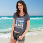Woman wearing a 'AMI Strong' t-shirt on a beach with ocean in the background