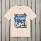 Beige t-shirt with 'AMI Strong' graphic design on a rustic nautical wood  background