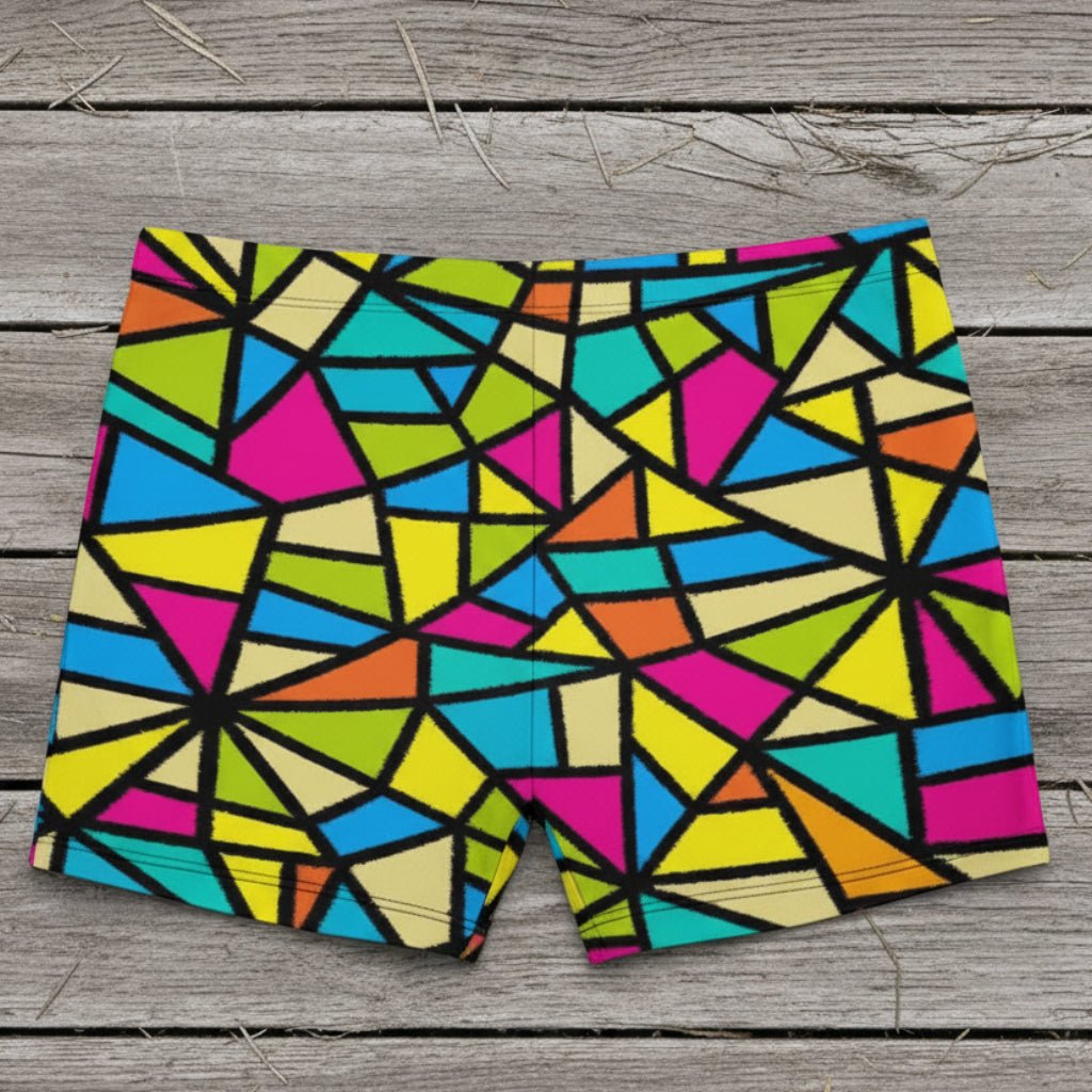 Colorful geometric patterned shorts on a wooden surface