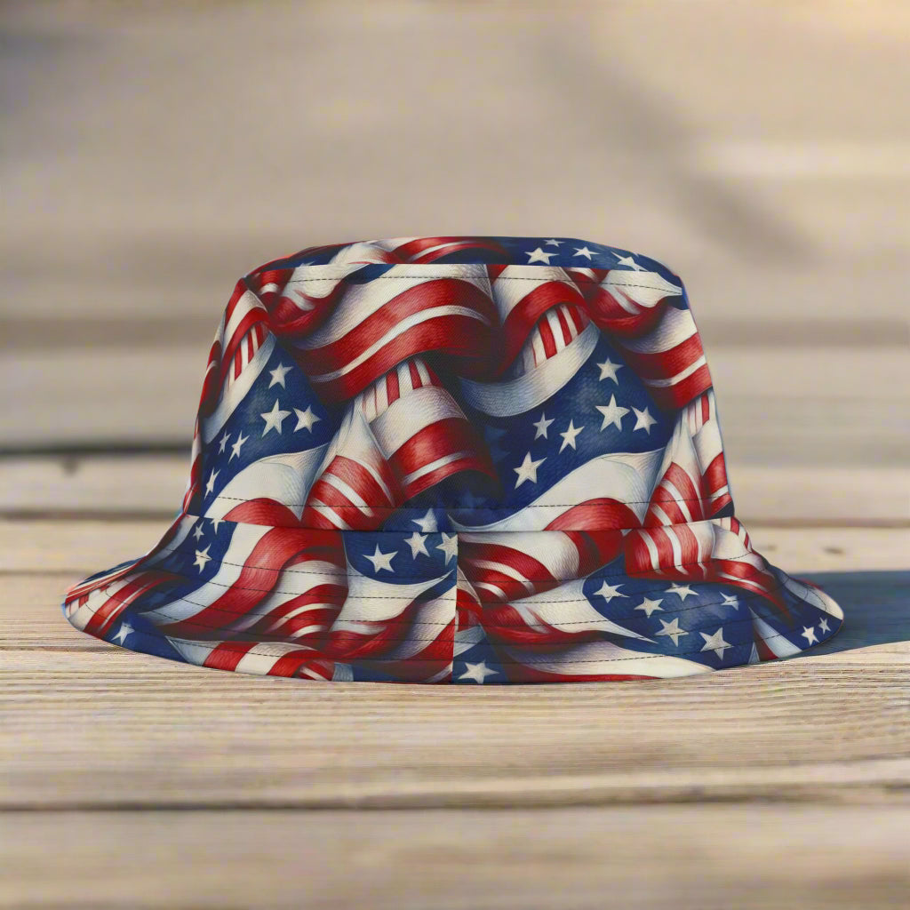 An American Flag pattern bucket hat sitting on a beach side boardwalk