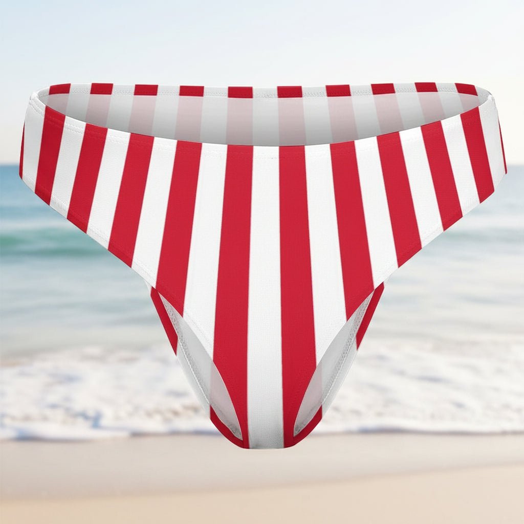Red and white striped bikini bottom on a faded beach background