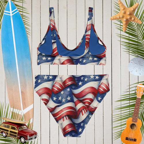 American flag swimsuit on a wooden background with beach accessories.