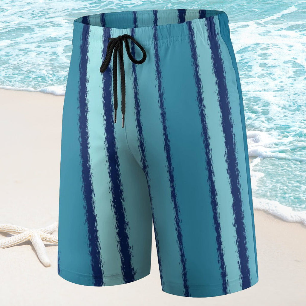 Blue and white striped swim shorts with a beach background