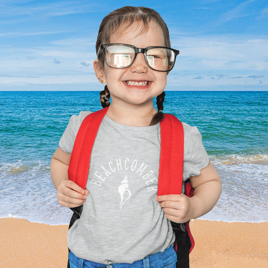 Toddler in Beachcomber Tee standing  on the beach