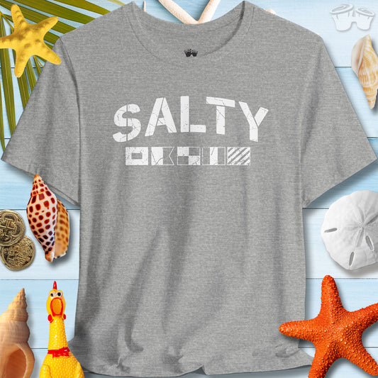 Salty Coastal Vibes Bella Canvas T-Shirt with nautical flags on a beach themed background.