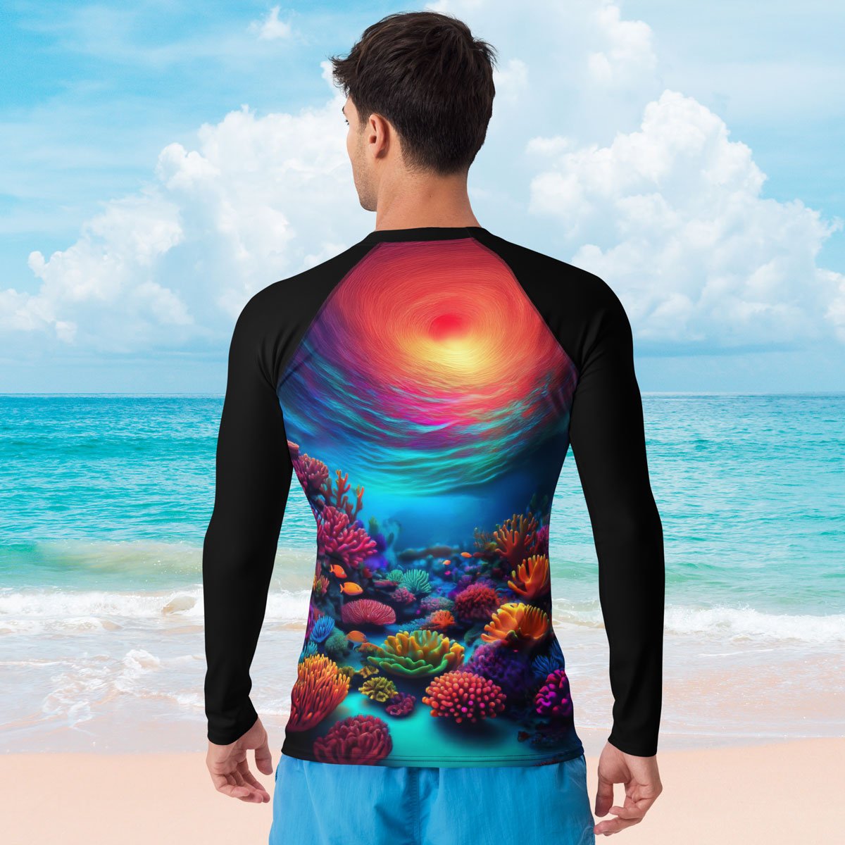 Person wearing a colorful coral reef-themed shirt on a beach