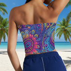 Colorful strapless top with abstract tribal pattern worn by a person on a tropical island beach.