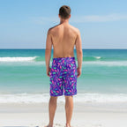 Guy wearing Colorful seashell-patterned board shorts on Pensacola Beach