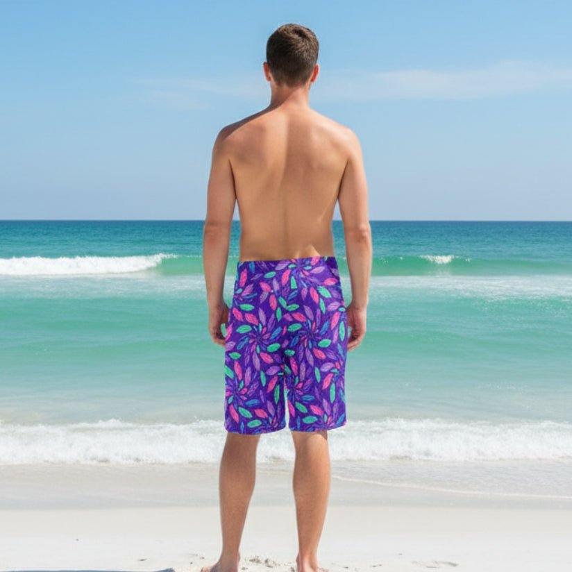 Guy wearing Colorful seashell-patterned board shorts on Pensacola Beach