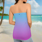 Woman ParrotHead wearing a strapless dress with a blue to purple ombré design on a Caribbean Island beach