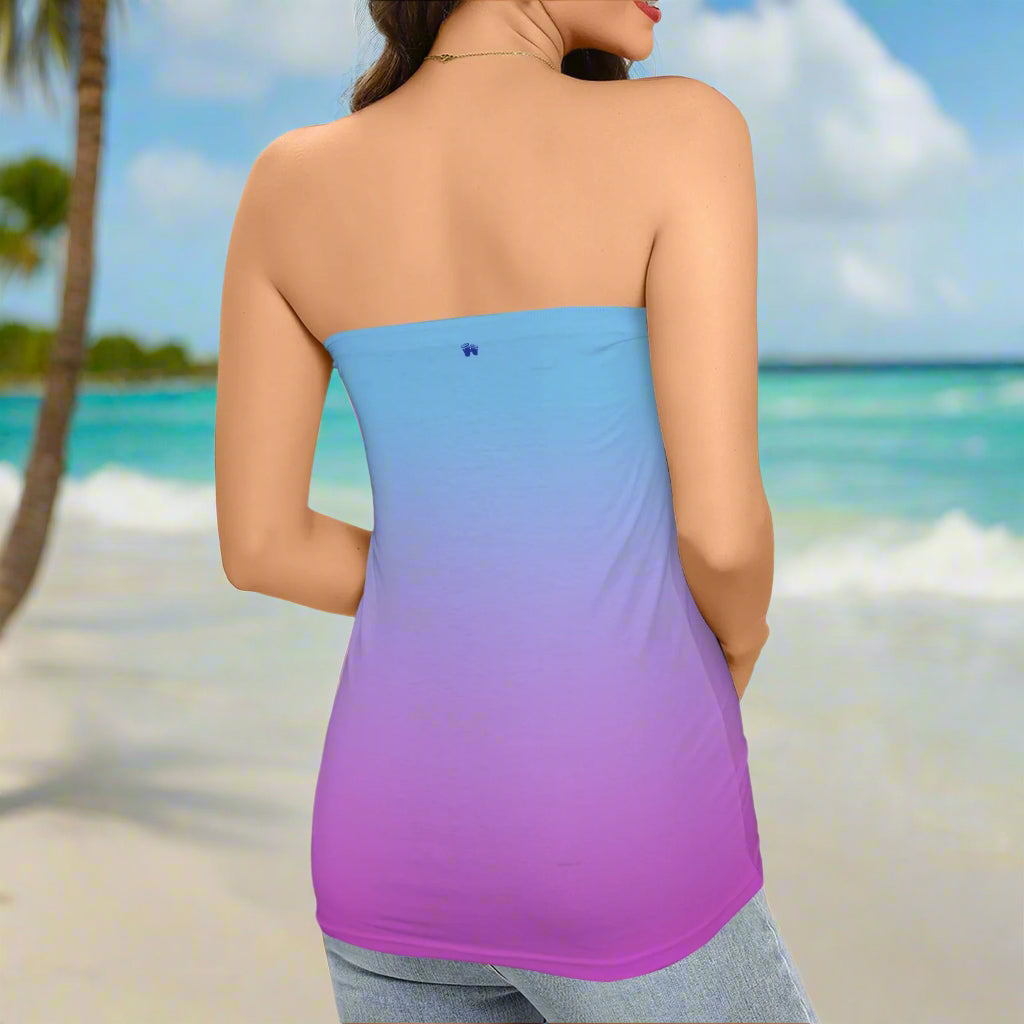 Woman ParrotHead wearing a strapless dress with a blue to purple ombré design on a Caribbean Island beach