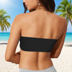 Black strapless bikini top worn by a model on a white background